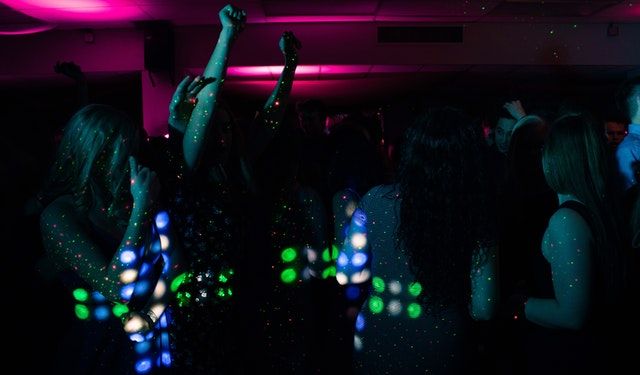 People are dancing in the dance floor area