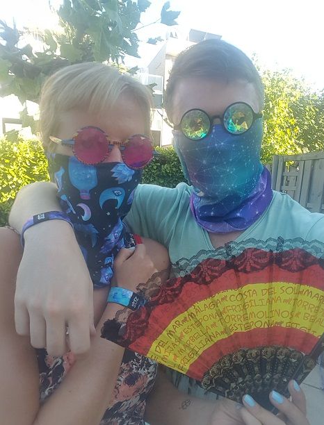 a male and a female wear some common rave accessories