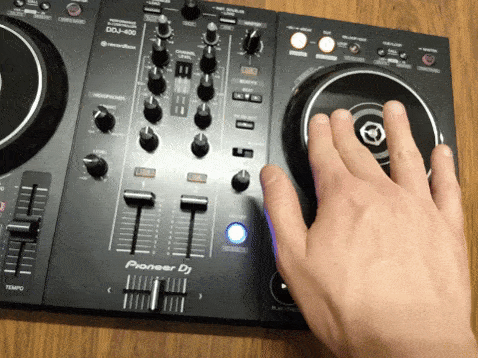 Visible scratching on a Pioneer DDJ-400 DJ controller with the right hand on the jog wheel