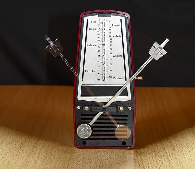 A moving metronome visible in two positions