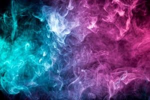 pink and blue smoke on a dark background